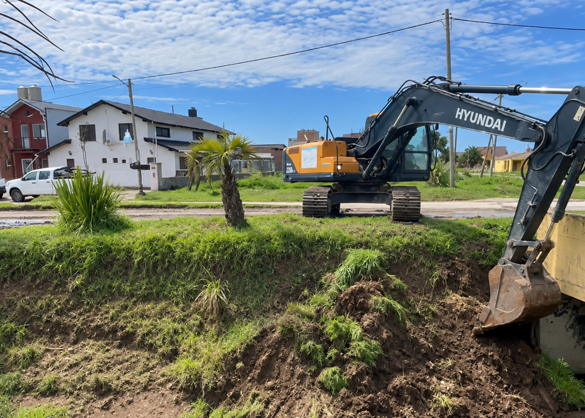 excavadora hyundai junto a zanja urbana